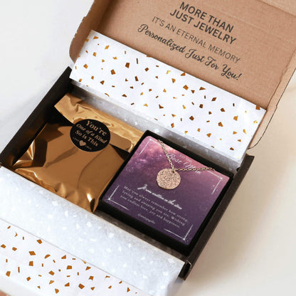 Personalized rose gold necklace with a coin pendant engraved in custom star map, packaging in a gift box with a festive greeting card for best mom and gold confetti paper, held by hands against a neutral background.