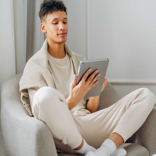 Men creating a star map on tablet